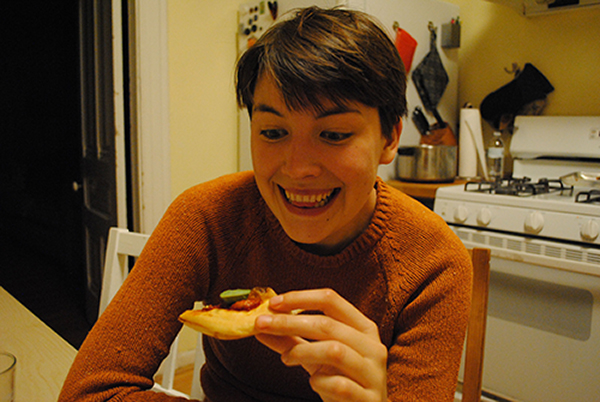 woman eating pizza